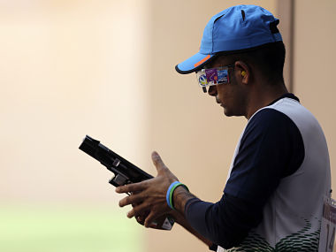India's Vijay Kumar changes the round in the men's shooting 25m rapid fire pistol qualification round at the London 2012 Olympic Games at the Royal Artillery Barracks