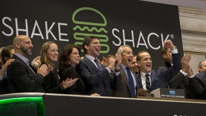 Shake Shack founder Danny Meyer and CEO Randy Garutti ring the opening bell at the New York Stock Exchange to celebrate their company's IPO